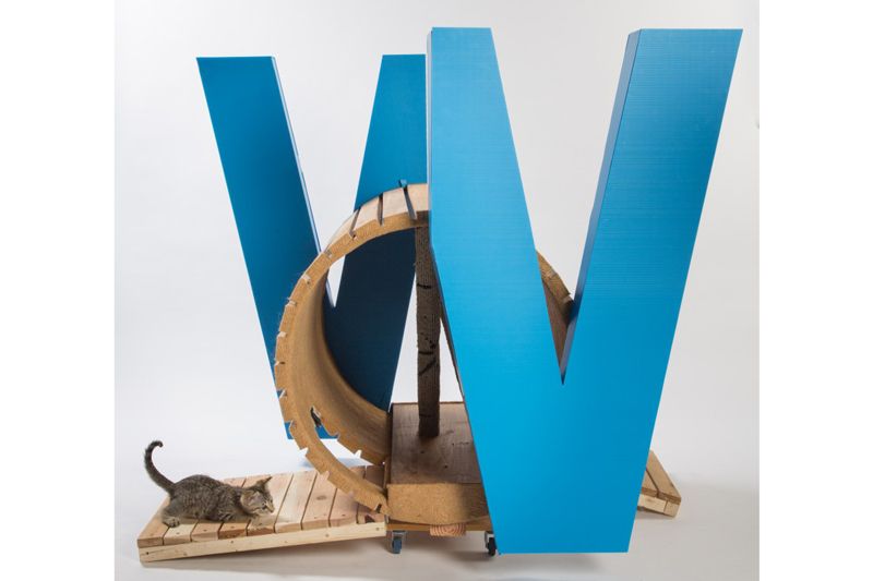 a wooden structure housed inside blue slats that form the letter W