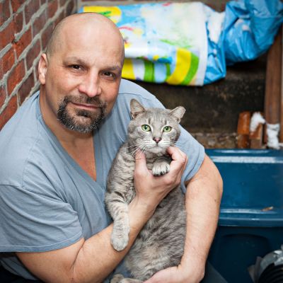 Man with grey cat